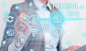 Writing note showing Helpful Tips. Business photo showcasing advices given to be helpful knowledge in life Female human wear formal work suit presenting smart device.